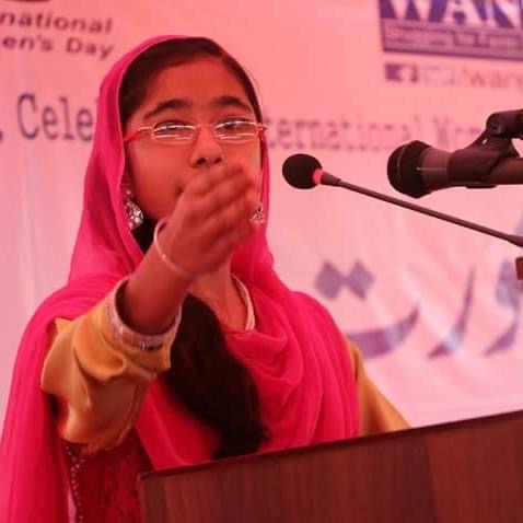 Girl speaking at podium during WANG leadership event