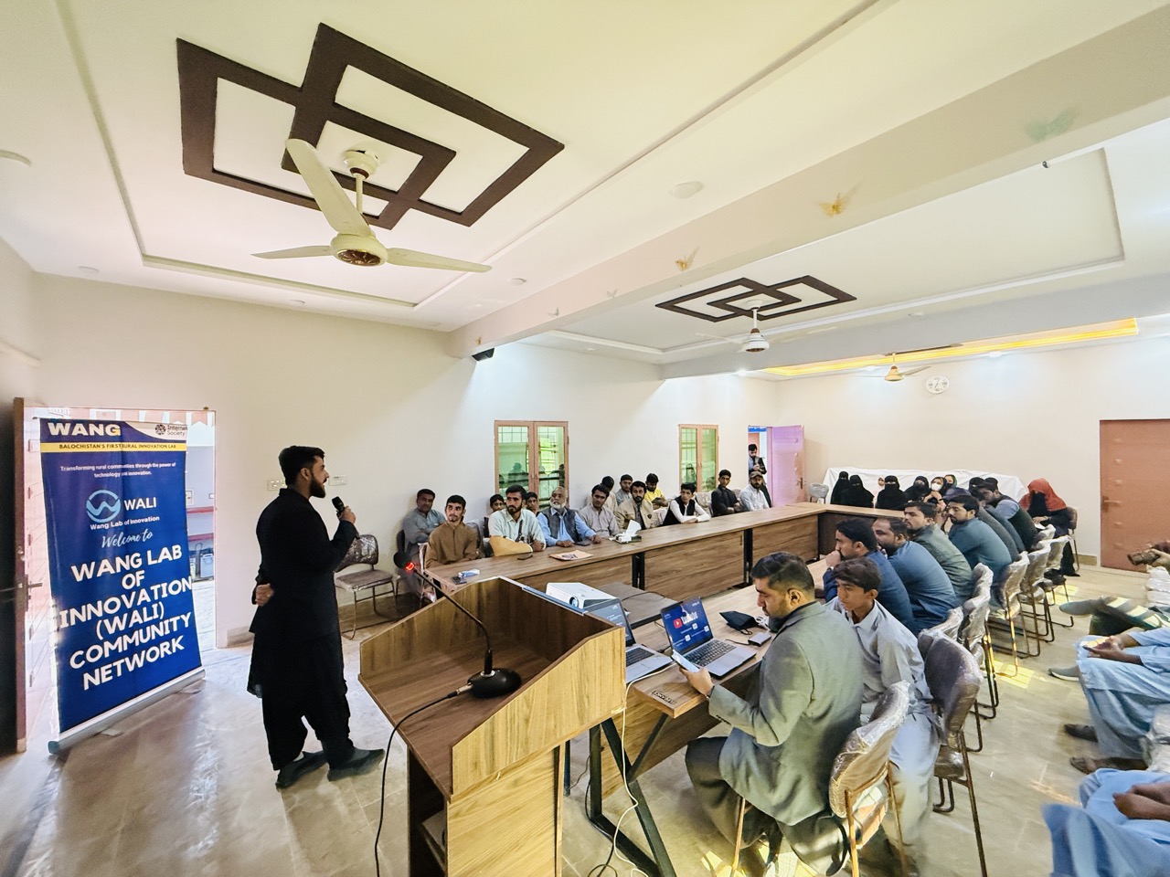 WALI Lab community network session with presenter and attendees in modern training room