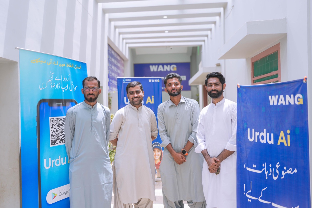 WANG team at WALI Lab entrance — K-Electric Karachi Awards 2025 winner