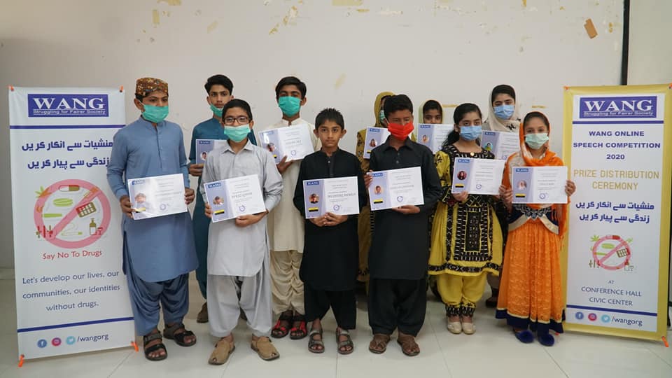 Youth speech competition winners holding anti-drug certificates at WANG event 2020